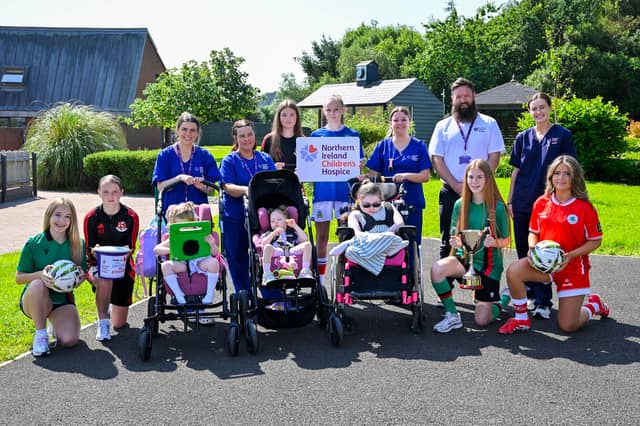 David Dixon, Community and Fundraising Relationship Manager at Northern Ireland Children's Hospice, and William Campbell, Director of the Budget Energy SuperCupNI, are pictured with patients from Northern Ireland Children's Hospice and players from Glentoran, Crusaders, Linfield and Cliftonville following the announcement of the Hospice as the Official Charity Partner of the 2026 Budget Energy SuperCupNI ahead of this summer's Girls' Tournament.