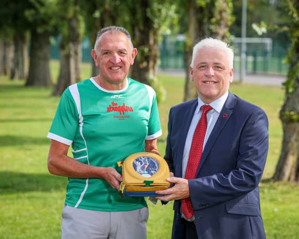 Keady Michael Dwyers GAA club chairman Patrick Óg Nugent and Fearghal McKinney, head of BHF NI