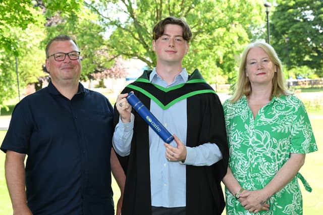 Sam Robinson from Derry celebrates his graduation with his parents Alastair and Alison Robinson.