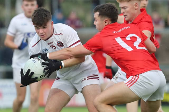Magherafelt Paddy McLarnon with Eoin Mulholland of Slaughtneil during the Derry Senior Football Championship match at Owenbeg.