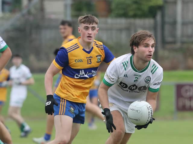 Caolan Tierney, Limavady, with Marcas O'Mianain of Craigbane during the Derry IFC match.