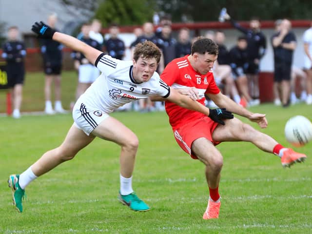 Drumsurn’s Shea Murray gets ready to score another point despite St. Malachy's Castledawson’s Colman Bradley effort trying to block.