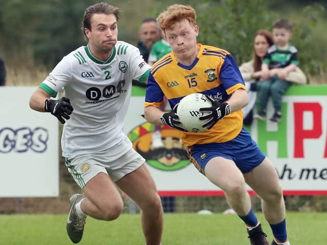 Limavady's Eunan McLaughlin with Marcas O'Mianain of Craigbane during the Derry IFC match on Saturday.
