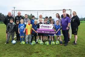 Pictured (L-R) are coaches Joe Doherty and Seamus Heath, Joanne McGowan (Choice Housing Officer), Patrick McClean (City of Derry Football Club), Mark Kent (Choice Good Relations Officer) and Coach Rosie McColgan. They are joined by young people from Rosses Gate.