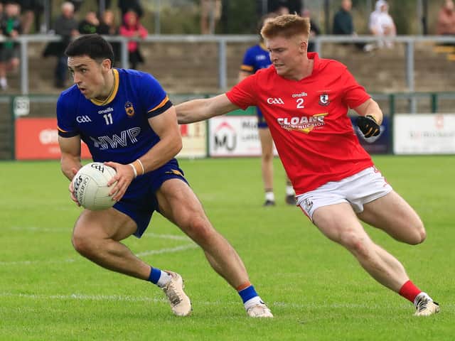 Steelstown’s Ben McCarron looks for the target as Magherafelt’s Turlough Cartin closes in.