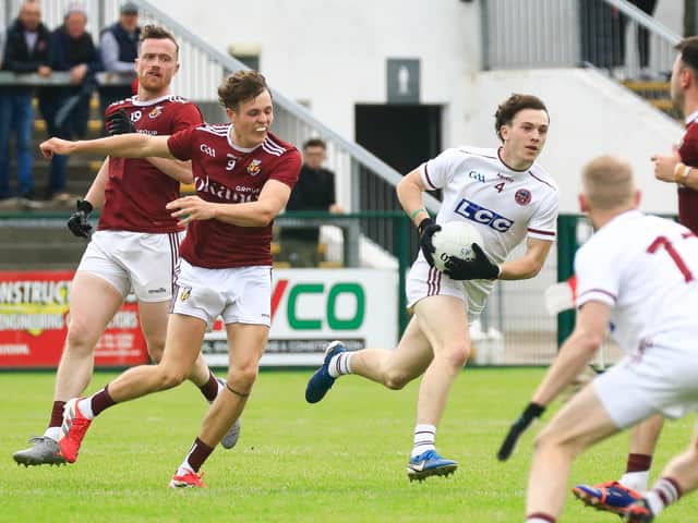 Slaughtneil’s Eamon Cassidy makes a break with the ball.