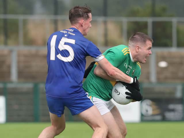 Glen Paul Gunning with Dara Doherty of Bellaghy during Sundays Derry SFC match at Owenbeg.