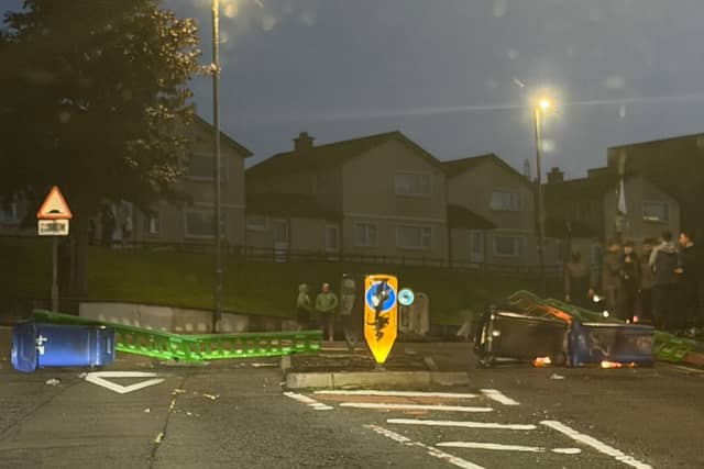 Petrol bombs were subsequently thrown at police by some of those present. Some also blocked the road, at the junction of Trench Road and Strabane Old Road, using wheelie bins and other items.