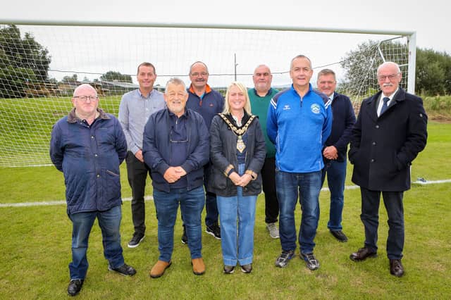 Mayor of Causeway Coast and Glens, Councillor Dawn Huggins with players and committee members of Burnfoot FC. Also included is Michael O'Brien, Council's Sports and Facilities Manager and Councillor Edgar Scott.
