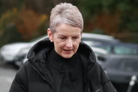 Eleanor Donaldson walking outside, wearing a black coat
