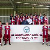 SuperValu Newbuildings store manager Paul Kayne (centra) visits Newbuildings United FC. The SuperValu store has sponsored training gear and provides match day refreshments.