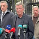 Breandan Mac Connaith speaking to the media flanked by three other men