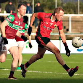 Greenlough’s Brian McCallion solos the ball up the field in the semi-final against  Eoghan Rua. 