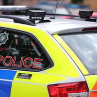 Three officers injured after lorry on wrong side of road hits police car