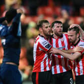Derry City players, from left, Jamie Stott, Patrick McClean and Cameron Dummigan celebrate a clearance during Monday night's game against St Patrick's Athletic at Brandywell.