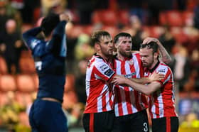 Derry City players, from left, Jamie Stott, Patrick McClean and Cameron Dummigan celebrate a clearance during Monday night's game against St Patrick's Athletic at Brandywell.