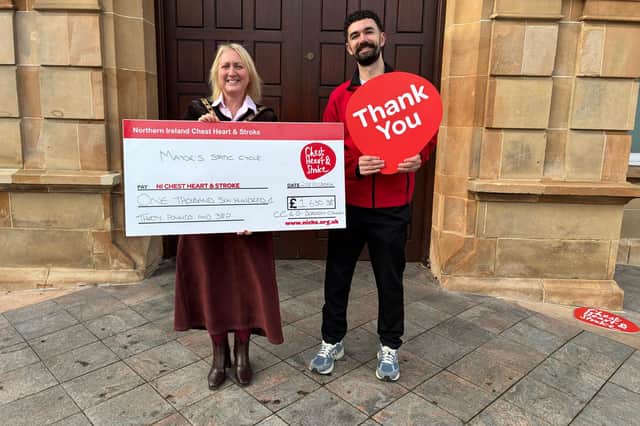 The Mayor pictured making a presentation to the charity.