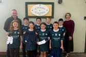 Pictured are students from St. Patrick's & St. Joseph's Primary School with Phelim Sharvin, Head of Community Finance (Northern Ireland) with Community Finance Ireland and Principal Catherine Ball.