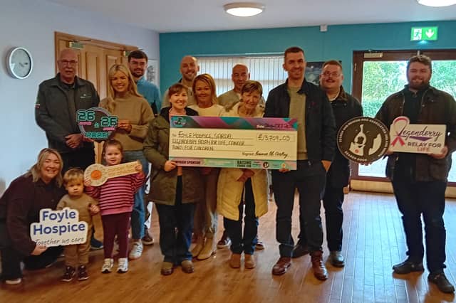 Seamus McCloskey, Dungiven, along with family and friends with a cheque for £13,709.03, raised from his 26 in 26 challenge.