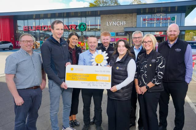 Connor Lynch, Lynch’s Director, presenting Cora McConnell from Cancer Fund for Children with a cheque for £14,000. Also pictured are Denise Ferguson, area manager at Lynch's, James Kelly from Lynch's Trench Road, Paul Hepburn, store manager at Lynch's Draperstown, Chris Curran, store manager at Lynch's Whitehouse, Peter Lynch, store manager at Lynch's Skeoge, Ciara Moore, store manager at Lynch's Caw and Steven McGreanery, store manager at Lynch's Greysteel.