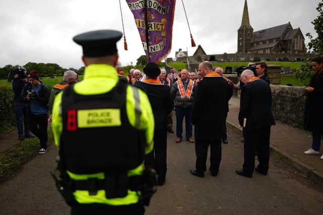 Orangemen at a police barricade close to Drumcree Church formed to prevent them entering the Garvaghy Road (PA)
