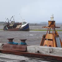 Coastal communities told to remain vigilant for floods as wind warnings lifted