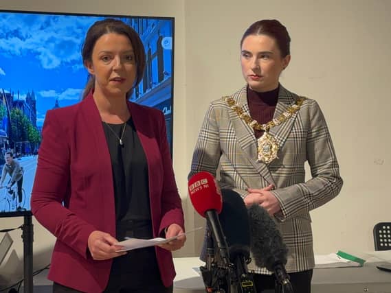 Stormont Infrastructure Minister Liz Kimmins (left) and Belfast Lord Mayor Róis-Máire Donnelly speaking to the media
