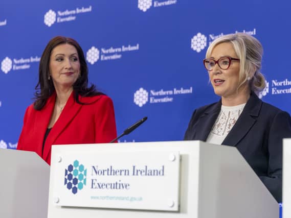 Emma Little-Pengelly looking at Michelle O’Neill beside her, who is speaking