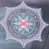 A stock picture of a Police Service of Northern Ireland (PSNI) logo badge in Belfast Northern Ireland