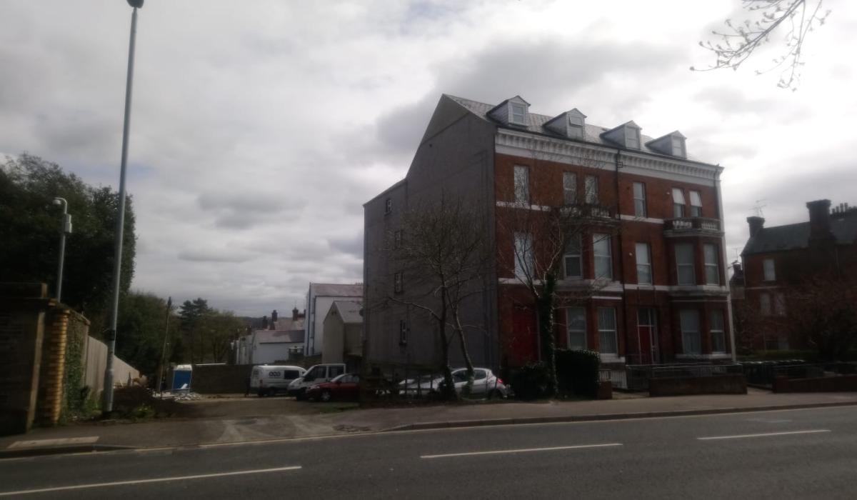 Contested plans for apartment complex on a vacant site in Derry have