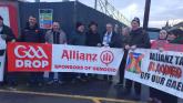 Derry and Tyrone greats at Saturday's Celtic Park 'Drop Allianz' protest.