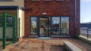 Community clean-up organised in response to overnight arson attack on a centre in Derry for people with learning disabilities