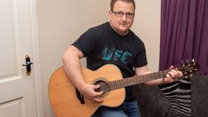 Derry man stunned to receive a guitar in the post from his musical hero Garth Brooks