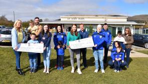 Cara and Orla hand over fundraising cheques