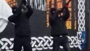Police launch investigation after shots fired at a commemoration event in Derry