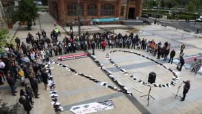 Families of victims of 'The Troubles' stage protest in Derry