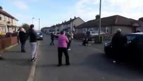 Wonderful gesture as neighbours of a Derry pensioner gather outside her home to sing happy birthday to her