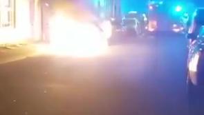 VIDEO: Car set on fire during petrol bomb attack outside houses in a terraced street in Derry
