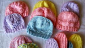 Derry AMH knitting hats and "yarn hugs" to send to babies of Ukraine