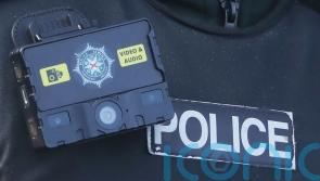 Man charged after police officer butted and kicked in the head