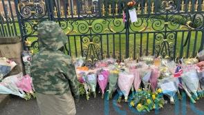 People come to gates of castle to pay respects to the Queen