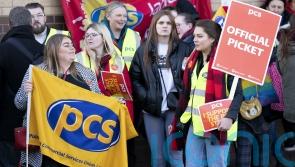 Passport workers begin five-week strike in row over pay and conditions