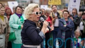 Police form line between rival transgender debate demos in Belfast