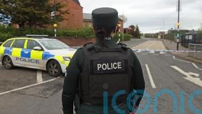 Man charged after crash close to Belfast police station