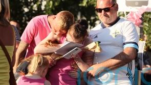 Brother of murdered 21-year-old woman thanks community as hundreds attend vigil