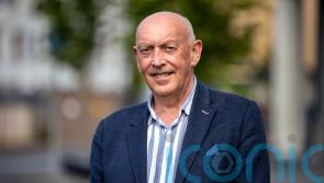 Man who helped bring about Queen and McGuinness handshake becomes a CBE