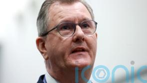 Donaldson says he will not ‘bow to threats’ amid warning of loyalist protests
