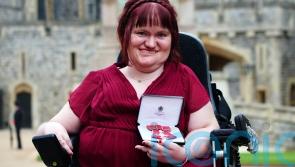 Disability rights activist becomes MBE in Windsor Castle ceremony