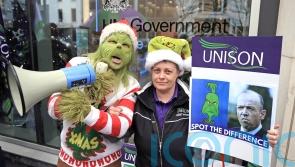 Health workers in Northern Ireland stage Grinch protest in pay dispute