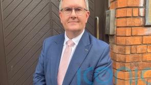 Threats against Donaldson over powersharing talks condemned in Parliament
